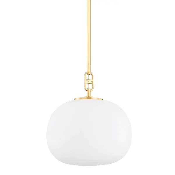 The Ingels pendant reimagines the classic globe with an elliptical opal glass shade and distinctive buckle-style hardware. Its warm aged brass finish and soft diffused light make it ideal for intimate dining spaces and kitchen islands.