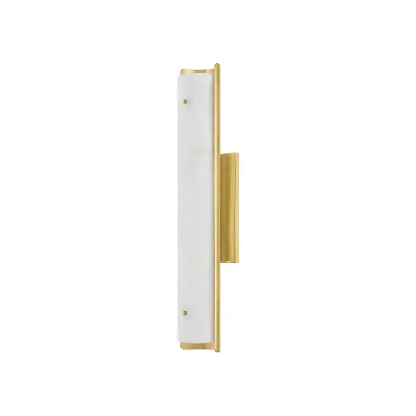 The Lucio wall sconce combines upscale minimalism with natural beauty through its striking alabaster bar framed in aged brass metalwork. Its versatile design transitions seamlessly from living spaces to bathrooms, while decorative pins add refined detail to the sleek profile.