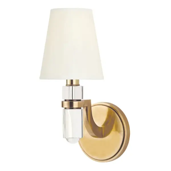The Dayton wall sconce combines timeless design with versatile styling. Its aged brass finish and faux silk shade create warm, ambient lighting perfect for intimate spaces. Compact at 5" wide, it fits beautifully in hallways and bathrooms.