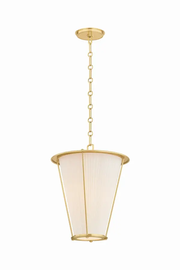 Ellsworth reimagines the classic lantern with sophisticated material pairing—a pleated ivory silk shade within a structured Aged Brass frame. Ornamental rivets and slender vertical rods add tailored detail, while the adjustable chain allows versatile installation heights.