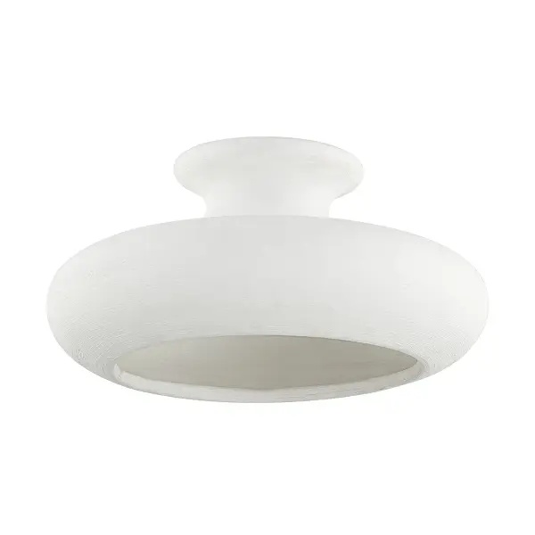 A refined single-light semi-flush mount featuring warm aged brass finish and clear glass. Perfect for smaller rooms needing ambient lighting with a touch of sophistication. The compact profile works well in spaces with standard ceiling heights.