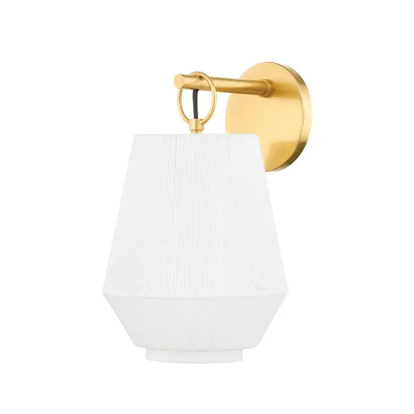 Debi's multi-dimensional design combines a crisp linen drum shade with delicate linen-wrapped metal frame and aged brass accents. The layered construction creates visual depth while maintaining a clean, sophisticated profile.