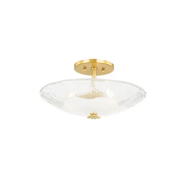The Lago semi-flush mount showcases exceptional hand-blown piastra glass with unique opaque Blonchino centers. Light reflects beautifully off the ceiling, creating a mesmerizing ambient glow. The aged brass finial adds sophisticated detail to this artisanal piece.