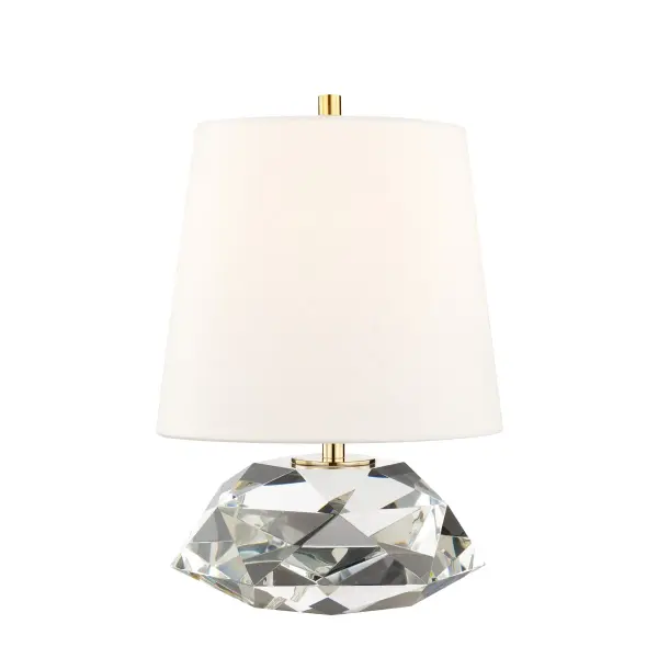 The Henley table lamp combines a multifaceted crystal base with aged brass accents and a Belgium linen shade for sophisticated style. Its compact 9.5-inch footprint and substantial weight provide visual anchoring while the full-range dimmer offers lighting flexibility.