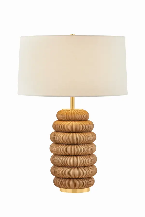 The Winbrook brings natural warmth through its honeycomb-inspired rattan base paired with aged brass accents. Its substantial 27.75-inch height and textured organic form make it a statement piece that balances earthy materials with refined metalwork.