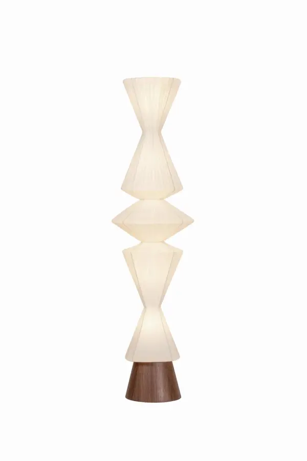 The Greendale floor lamp transforms any space with its serene, totemic silhouette crafted from handmade paper. Its geometric form and subtle vertical texture create a warm, diffused glow, while the wood veneer base adds natural grounding.
