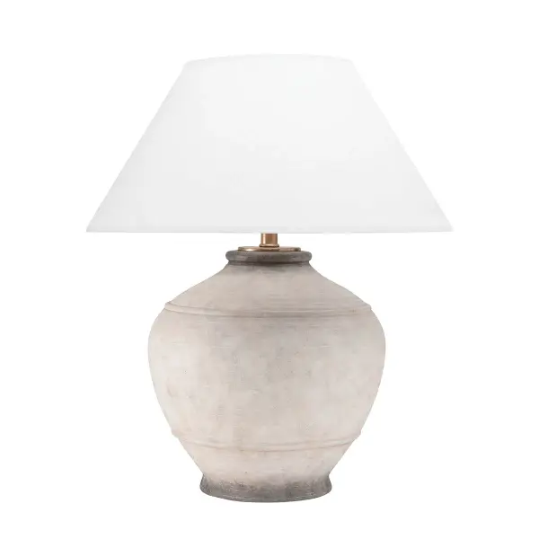The Malta table lamp showcases natural ash wood construction with a distinctive sculptural form. At 29 inches tall with a generous 21-inch base, it makes a bold statement while the white linen shade softens the look. Full-range dimming capability and quality construction justify the premium positioning.