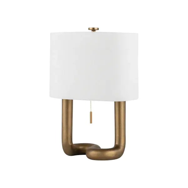 The Armonk table lamp combines bold sculptural form with warm materiality. Its curvilinear aged brass body creates visual interest while the large-grained linen shade softens the light. A playful yet sophisticated piece.