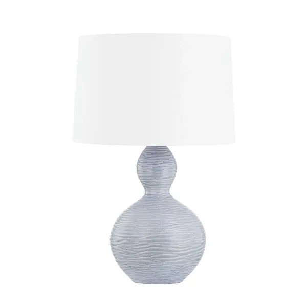 This Hudson Valley table lamp combines aged brass metalwork with a distinctive ceramic crackle black finish, creating a refined accent piece that bridges traditional craftsmanship and contemporary design.