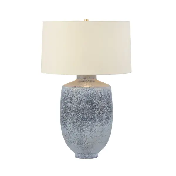 Soft architectural lines and a color-saturated palette give the Hensonville table lamp its dreamy sense of ease. Reminiscent of weathered sea glass, the Oceanside glaze drifts across the ceramic surface in a gentle tonal gradient, shifting between tranquil blues and sandy taupe undertones. A crisp white linen drum shade serves as a tailored counterpoint to the expressive base, while concealed Aged Brass hardware lends a final note of polish. Due to the one-of-a-kind nature of the medium, exact colors and patterns may vary slightly from the image shown. Collection: Hensonville Designer: Hudson Valley Lighting Finish: Aged Brass Glass: White Linen Width: 20.50" Height: 30.75" Weight: 17.64 lb Number of Bulbs: 1 Maximum Wattage: 15.00 W Bulb Type: A19 Bulb Base: E26 Medium Voltage: 120.00 V Material: Ceramic Country of Origin: VN Safety Listing: UL/cUL Safety Rating: Dry Switch: FULL RANGE DIMMER ON SOCKET Manufacturer Warranty: 1 Year Limited Manufacturer Spec Sheet Instructions