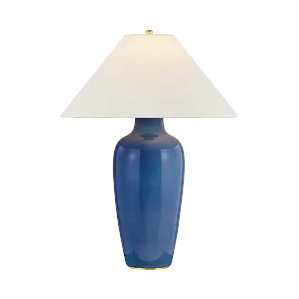 A classic urn form is brushed with an artisanal Indigo glaze in the dreamy Rhinelander table lamp. The ceramic finish shifts in a subtle ombre that transitions from a deep, glossy blue to a softer, weathered gradient at the neck and base. A crisp, conical white linen shade balances the expressive glaze, while concealed Aged Brass hardware completes the design. Due to the one-of-a-kind nature of the medium, exact colors and patterns may vary slightly from the image shown. Collection: Rhinelander Designer: Hudson Valley Lighting Finish: Aged Brass Glass: White Linen Width: 22.00" Height: 30.00" Weight: 16.53 lb Number of Bulbs: 1 Maximum Wattage: 15.00 W Bulb Type: A19 Bulb Base: E26 Medium Voltage: 120.00 V Material: Ceramic Country of Origin: VN Safety Listing: UL/cUL Safety Rating: Dry Switch: FULL RANGE DIMMER ON SOCKET Manufacturer Warranty: 1 Year Limited Manufacturer Spec Sheet Instructions