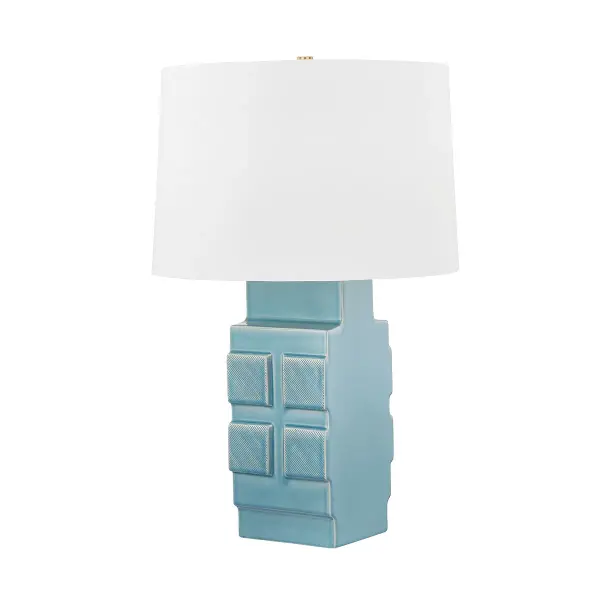 This Hudson Valley table lamp combines organic ceramic craftsmanship with aged brass accents. The moonstone granite finish creates visual texture and depth, making it a statement piece that bridges traditional and contemporary aesthetics.