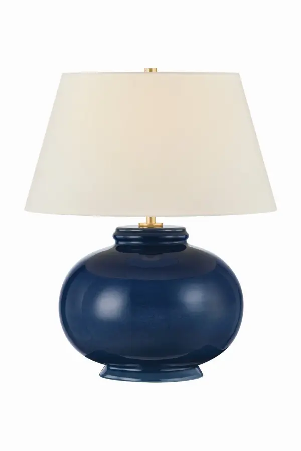 Playful color meets classic charm in the Moodus table lamp. Finished in a glossy Parrish Blue glaze, the voluminous ceramic base reflects and amplifies light, bringing a lively sense of movement to the design. A well-proportioned off-white linen tapered shade balances the vibrant glaze. With concealed Aged Brass hardware, this joyful accent lamp adds a pop of personality to any space. Due to the one-of-a-kind nature of the medium, exact colors and patterns may vary slightly from the image shown. Collection: Moodus Designer: Hudson Valley Lighting Finish: Aged Brass Glass: Off White Linen Width: 20.00" Height: 22.00" Weight: 17.42 lb Number of Bulbs: 1 Maximum Wattage: 15.00 W Bulb Type: A19 Bulb Base: E26 Medium Voltage: 120.00 V Material: Ceramic Country of Origin: VN Safety Listing: UL/cUL Safety Rating: Dry Switch: FULL RANGE DIMMER ON SOCKET Manufacturer Warranty: 1 Year Limited Manufacturer Spec Sheet Instructions