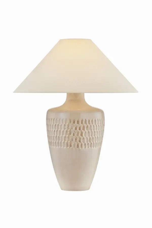 This single-light table lamp from Hudson Valley Lighting combines aged brass metalwork with a cream fabric shade for versatile elegance. The transitional design bridges traditional and contemporary aesthetics, making it adaptable to various interior styles.