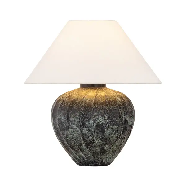 The Arlin family of table lamps pairs sculptural form with rich texture. Patterned metal bases feature a swirling motif that wraps each vessel shape, offered in two silhouettes: a fuller, more rounded form in Black Patina and a taller, generous form in Bronze Patina. A tapered off-white linen shade softens the look while echoing the lamps' curves, and Patina Brass hardware completes the design. Due to the one-of-a-kind nature of the medium, exact colors and patterns may vary slightly from the image shown. Collection: Arlin Designer: Hudson Valley Lighting Finish: Patina Brass Glass: Off White Linen Width: 22.00" Height: 23.00" Weight: 16.11 lb Number of Bulbs: 1 Maximum Wattage: 15.00 W Bulb Type: A19 Bulb Base: E26 Medium Voltage: 120.00 V Material: Ceramic Country of Origin: IN Safety Listing: UL, cETL Safety Rating: Dry Switch: ON/OFF SWITCH ON SOCKET Manufacturer Warranty: 1 Year Limited Manufacturer Spec Sheet Instructions