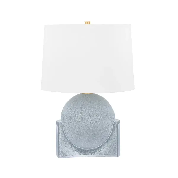 This Hudson Valley table lamp combines a handcrafted ceramic base with aged brass accents, featuring a distinctive reactive slate glaze that ensures each piece is unique. The transitional design bridges traditional and contemporary aesthetics.