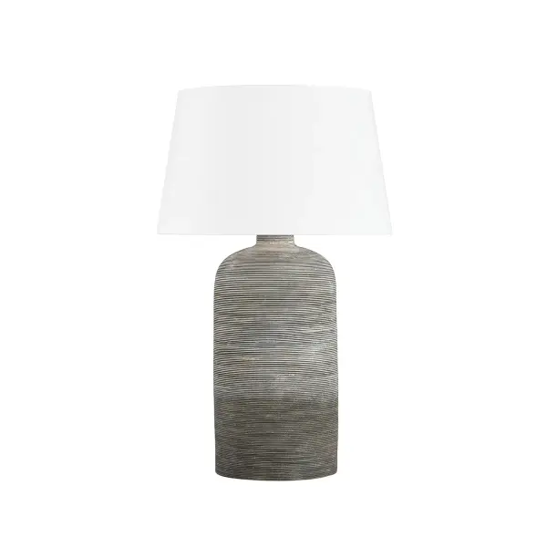 This Hudson Valley table lamp combines warm aged brass metalwork with a soft ceramic cream shade, creating a sophisticated accent piece that bridges traditional and contemporary design sensibilities.