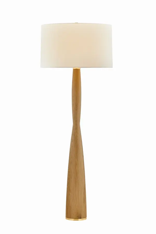 The Somers Chase combines artisanal craftsmanship with mid-century design. Its hand-carved light oak base features a distinctive tapered silhouette, while the oversized white linen drum shade provides ample ambient lighting. Aged brass accents add warmth and sophistication.