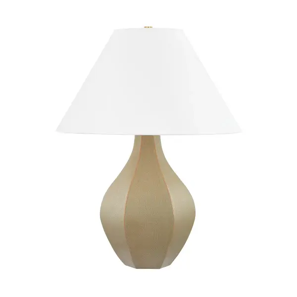 This distinctive table lamp features a handcrafted ceramic cocoon shade paired with aged brass accents, creating a sophisticated organic modern aesthetic. The textured ceramic diffuses light beautifully while serving as a sculptural statement piece.