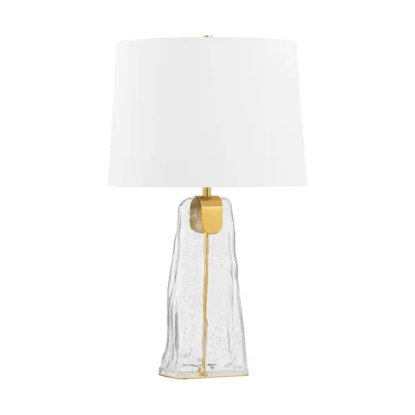 The Midura combines striking clear bubble glass with aged brass and a crisp white linen shade for a sophisticated modern aesthetic. Its glacial glass structure creates visual interest while the warm brass frame adds inviting contrast.