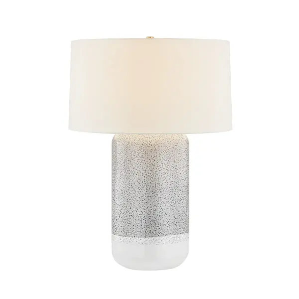 This Hudson Valley table lamp combines aged brass metalwork with a distinctive ceramic blue shore finish, creating a sophisticated accent piece that bridges traditional and contemporary design sensibilities.