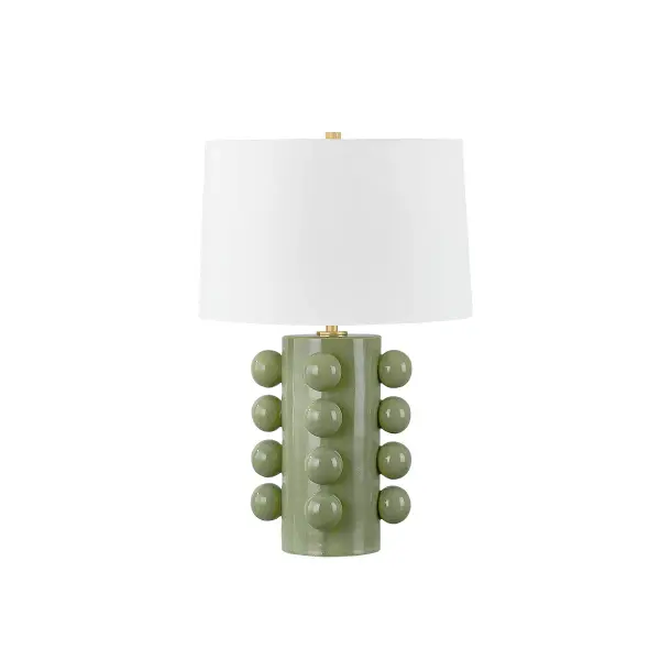 This sophisticated table lamp combines handcrafted ceramic with aged brass accents, featuring a distinctive moss crackle glaze. The artisanal finish brings organic texture and visual interest to any space.