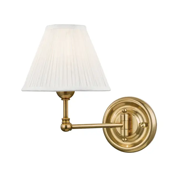 The Classic No.1 sconce by Mark D. Sikes delivers refined sophistication with its delicate curves and slender profile. The aged brass finish adds warmth while the compact 7.5-inch width makes it ideal for flanking mirrors or illuminating hallways without overwhelming the space.