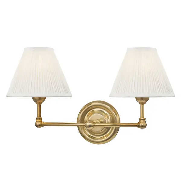 The Classic No.1 wall sconce by Mark D. Sikes delivers approachable elegance with its delicate curves and refined proportions. At 18.25 inches wide, it provides balanced illumination for vanities and hallways while complementing any aesthetic.