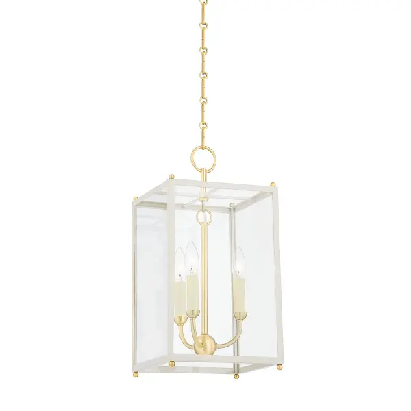 This three-light lantern combines aged brass metalwork with off-white fabric shades for a refined traditional look. The lantern silhouette works beautifully in entryways and dining spaces, offering both ambient and decorative lighting.