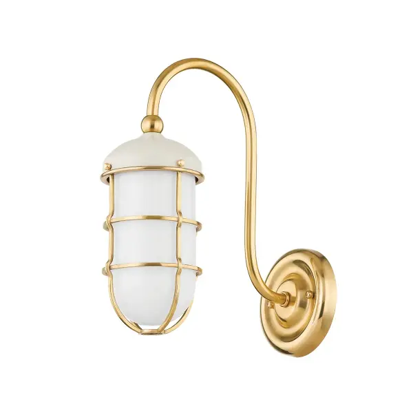 This Hudson Valley wall sconce combines aged brass metalwork with an off-white fabric shade for a refined, versatile look. The single-light design provides focused ambient lighting ideal for hallways, bedrooms, and bathrooms.