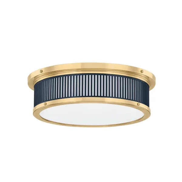 This Hudson Valley LED flush mount combines aged brass and distressed bronze finishes for a refined, transitional aesthetic. The integrated LED technology provides energy-efficient illumination ideal for low-ceiling spaces.