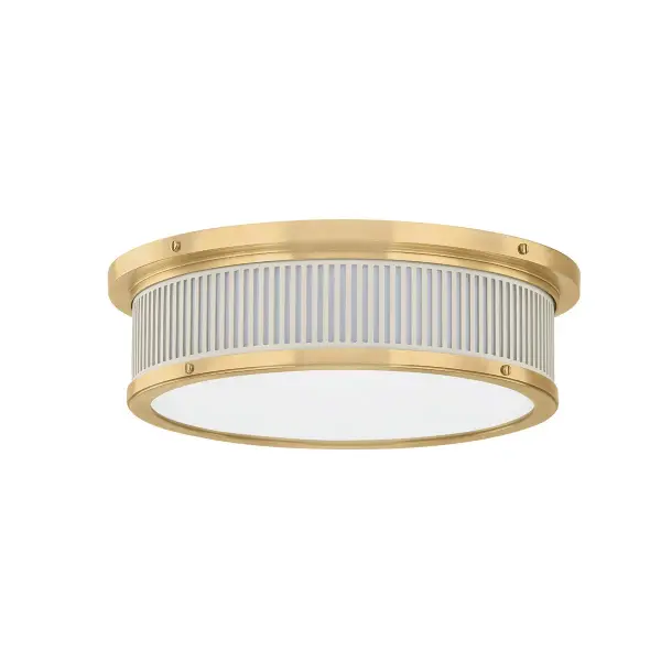 This Hudson Valley LED flush mount combines energy-efficient lighting with sophisticated style. The aged brass finish paired with an off-white shade creates a warm, inviting glow perfect for low-ceiling spaces.