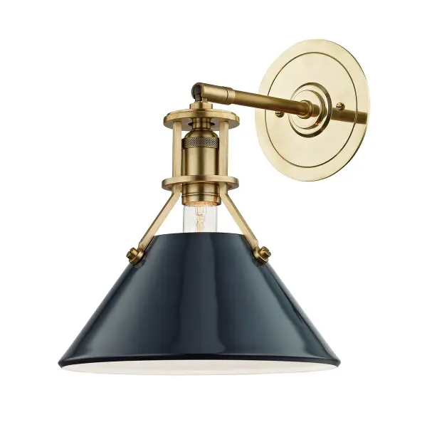 This Hudson Valley wall sconce combines aged brass warmth with a striking darkest blue accent, creating a refined focal point. The single-light design offers focused illumination ideal for task lighting or ambient accent in intimate spaces.