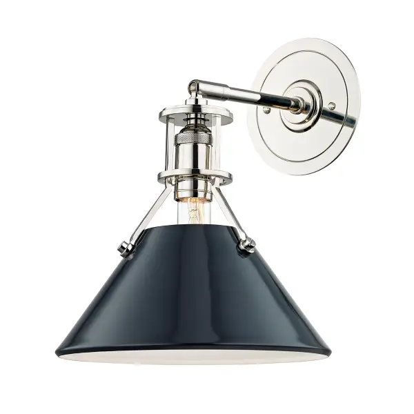 This single-light wall sconce combines polished nickel with a striking darkest blue finish, creating a contemporary statement piece. The dual-finish design adds visual interest while maintaining versatility for modern interiors.