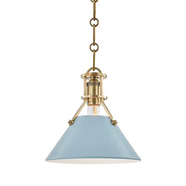 This Hudson Valley pendant combines warm aged brass metalwork with a striking blue bird glass shade, creating a sophisticated focal point. The single-light design offers versatile placement options for intimate spaces.