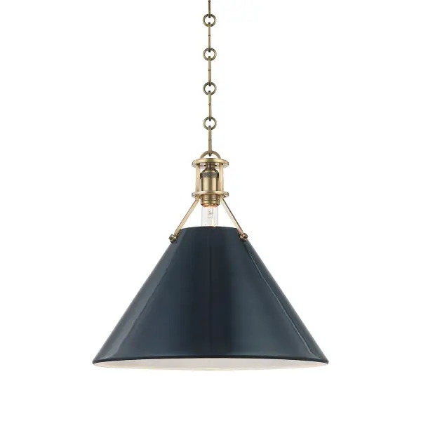 This Hudson Valley pendant combines aged brass warmth with a striking darkest blue accent, creating a refined focal point. The compact single-light design works beautifully in multiples or as a standalone accent piece.