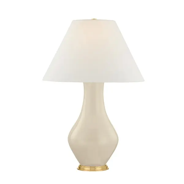 This sophisticated table lamp combines a sculptural ceramic base with aged brass hardware and a French muslin fabric shade. The organic form and warm metallic finish create a refined focal point for transitional and contemporary interiors.