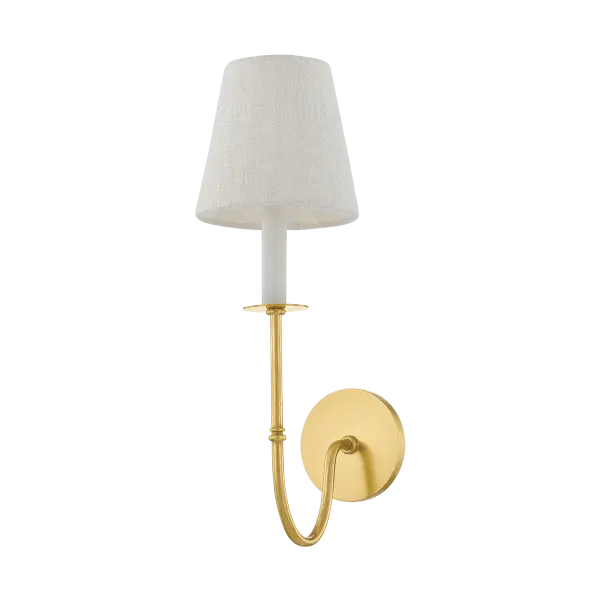 The Amina Wall Sconce beautifully bridges traditional and contemporary design with its Victorian-inspired metalwork, dramatic J-arm silhouette, and clean white linen shade. The Aged Brass finish adds warmth and sophistication.