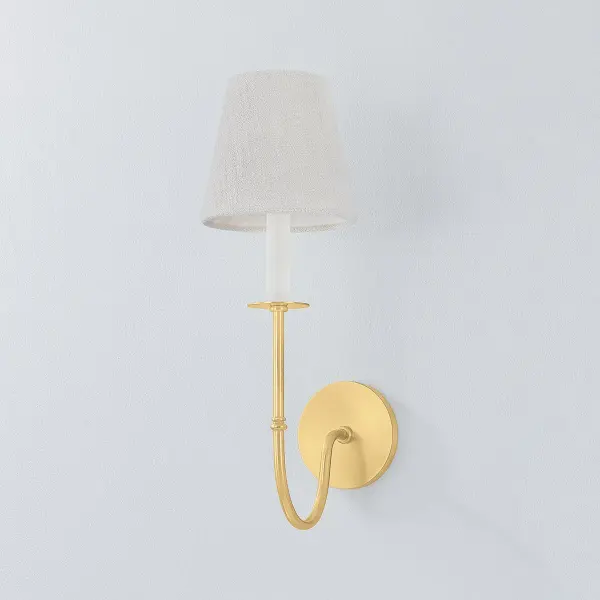 The Amina Wall Sconce beautifully bridges traditional and contemporary design with its Victorian-inspired metalwork, dramatic J-arm silhouette, and clean white linen shade. The Aged Brass finish adds warmth and sophistication. - alternate view