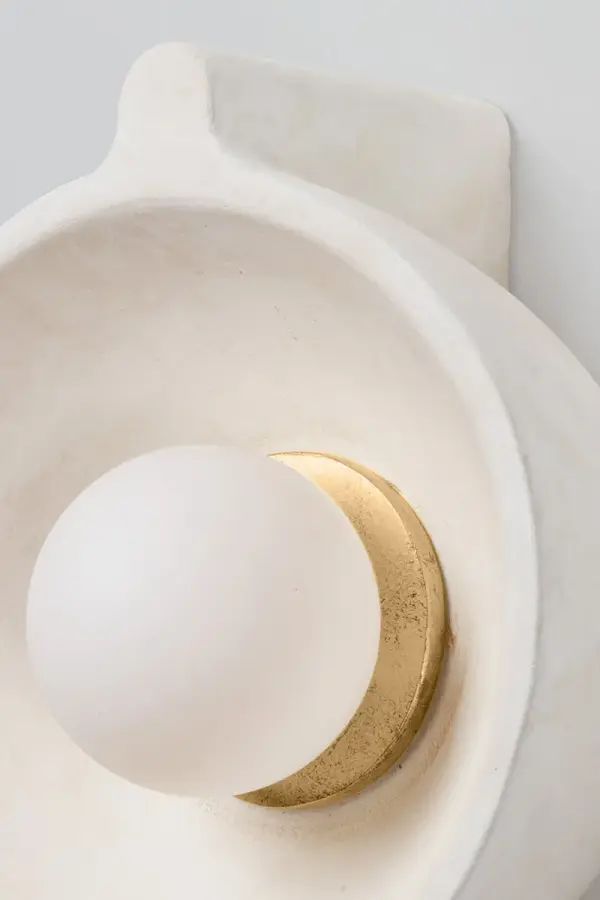 The Modesto Wall Sconce brings nautical charm to modern interiors with its finned dome shade in weathered Fossil White Ceramic. Vintage Gold Leaf hardware adds subtle elegance, making it perfect for coastal, modern, or transitional spaces. - alternate view