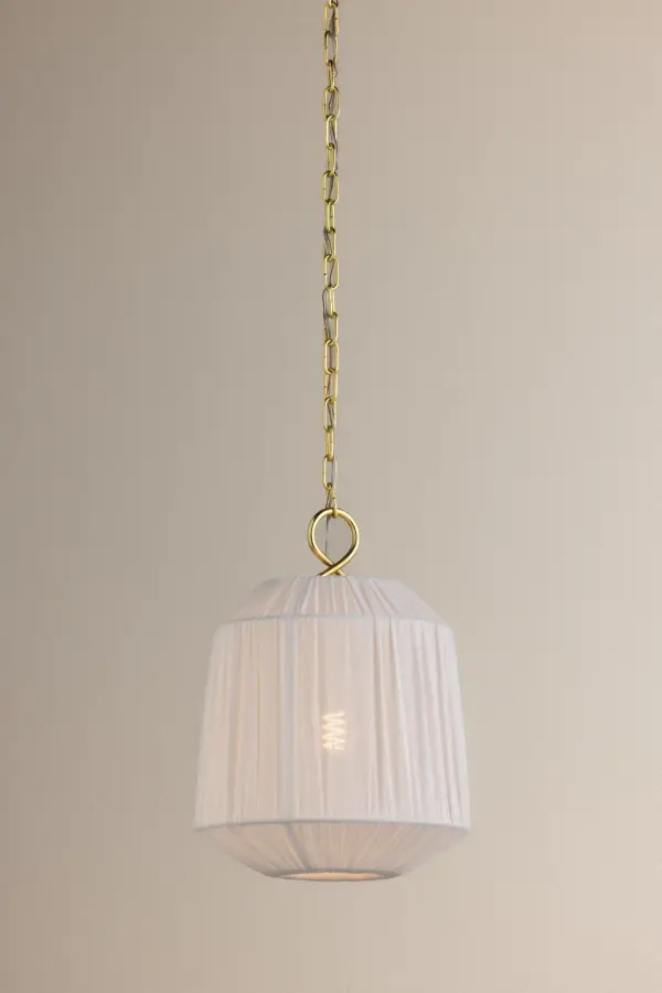 The Amanza pendant combines poetic beauty with practical design through its stretched linen shade and looped Aged Brass metalwork. Light and airy despite its abundant silhouette, it adds neutral sophistication to any space. - alternate view