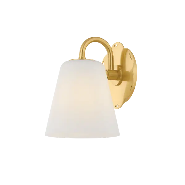 The Leonella sconce brings vintage charm to bathroom lighting with its botanical-inspired design. Swooping Aged Brass arms and floral backplate with decorative perforations create visual interest, while matte white bell shades provide powerful downlight.