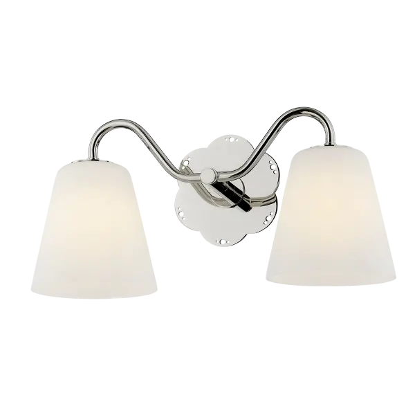The Leonella sconce brings vintage botanical elegance to bathroom lighting with its floral-shaped backplate and decorative perforations. Swooping arms hold bell-shaped matte white shades that provide powerful downlight for daily routines. - alternate view