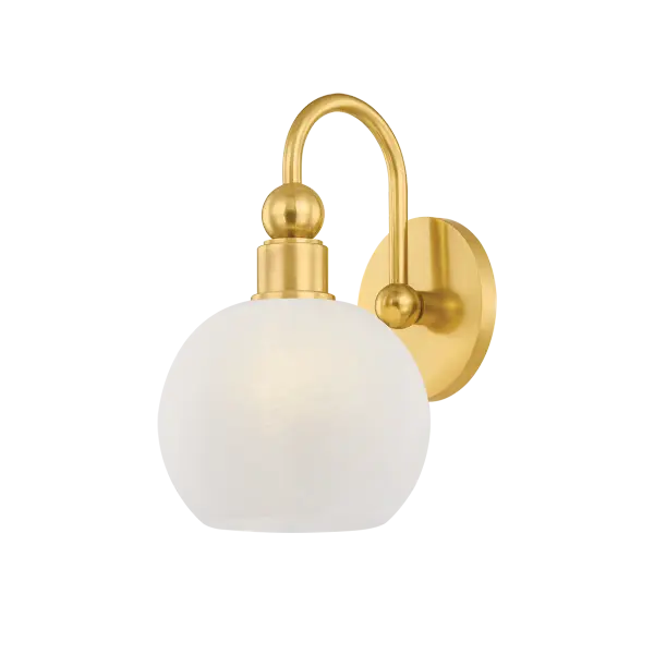 The Jerica bath light brings serene sophistication to daily routines with its harmonious circular forms and matte cloud glass globes. Decorative sphere details and curved lines create visual continuity in Aged Brass.