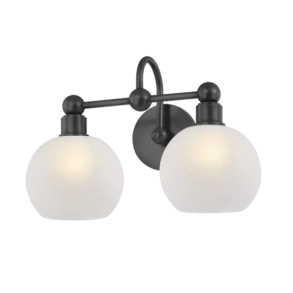 The Jerica bath light brings visual harmony through continuous circular forms and decorative sphere details. Matte cloud glass globes provide soft, diffused illumination while the Old Bronze finish adds modern sophistication.