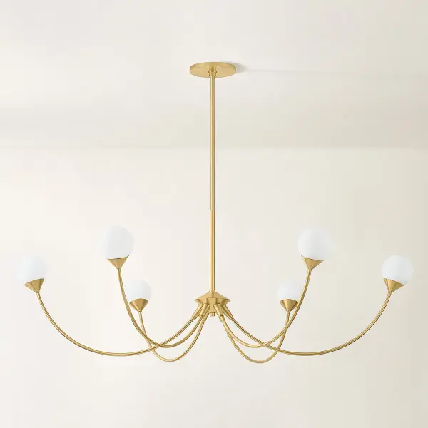 The Natasha Chandelier balances nostalgic elegance with contemporary design through swooping arches and cloud glass orbs. Its Aged Brass finish and sparse yet decadent silhouette create a fresh, daring statement piece. - alternate view