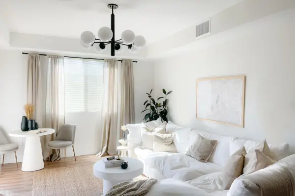 The Stella Chandelier brings fresh sophistication to mid-century modern design with its frosted glass globe and sleek curves. Versatile enough for any room, this fixture offers timeless style in an old bronze finish. - alternate view