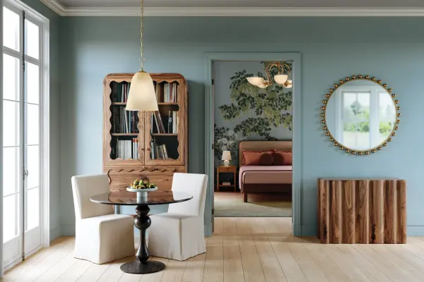 The Christine Pendant combines sophisticated glass treatments with distinctive looped chain details, creating a modern yet welcoming aesthetic. Its champagne glass shade provides gentle light diffusion while welded ring accents add decorative flair. - alternate view