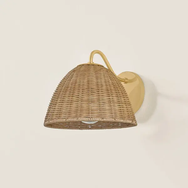 The Katniss Wall Sconce combines vintage natural wicker with aged brass for a fresh take on timeless design. Its mushroom-shaped shade adds botanical charm and textural interest to any space. - alternate view