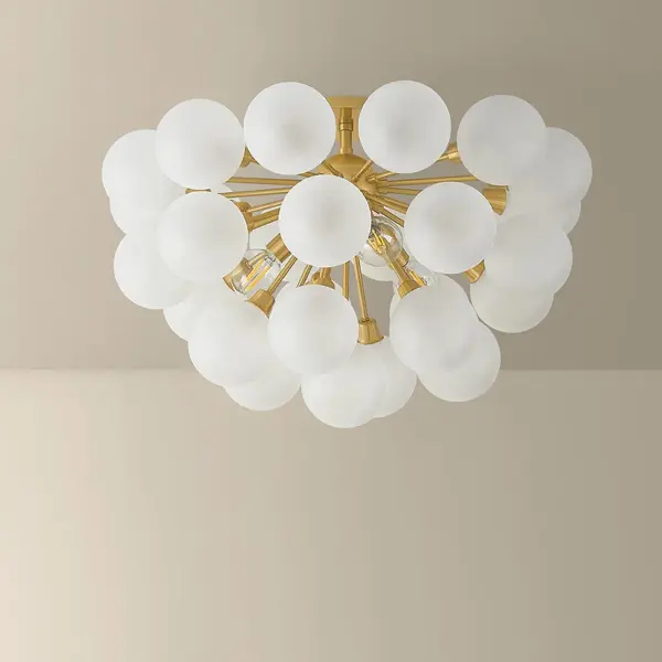 The Antoneta reimagines mid-century Sputnik design as a compact semi-flush fixture. Three etched glass globes create a bubbly, geometric silhouette while the Aged Brass finish adds warmth. Perfect for lower ceilings needing modern style. - alternate view